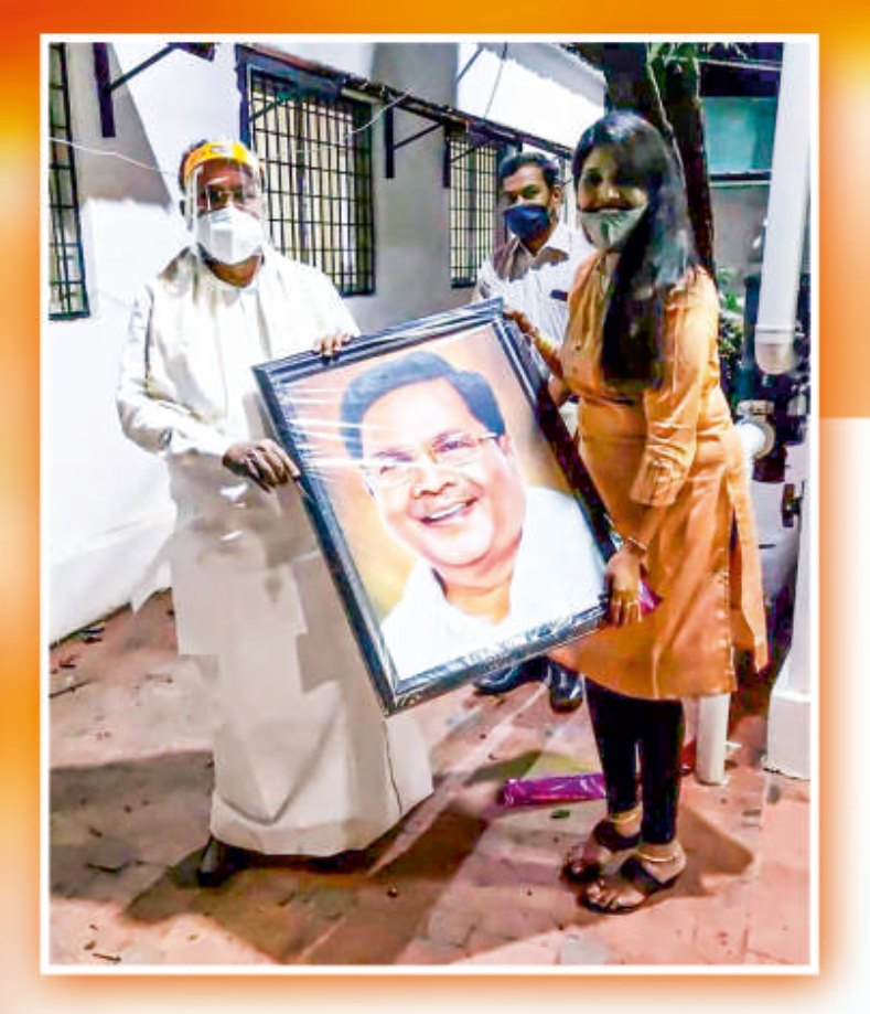 Dedicating a portrait of Chief Minister Shri Siddaramaiah